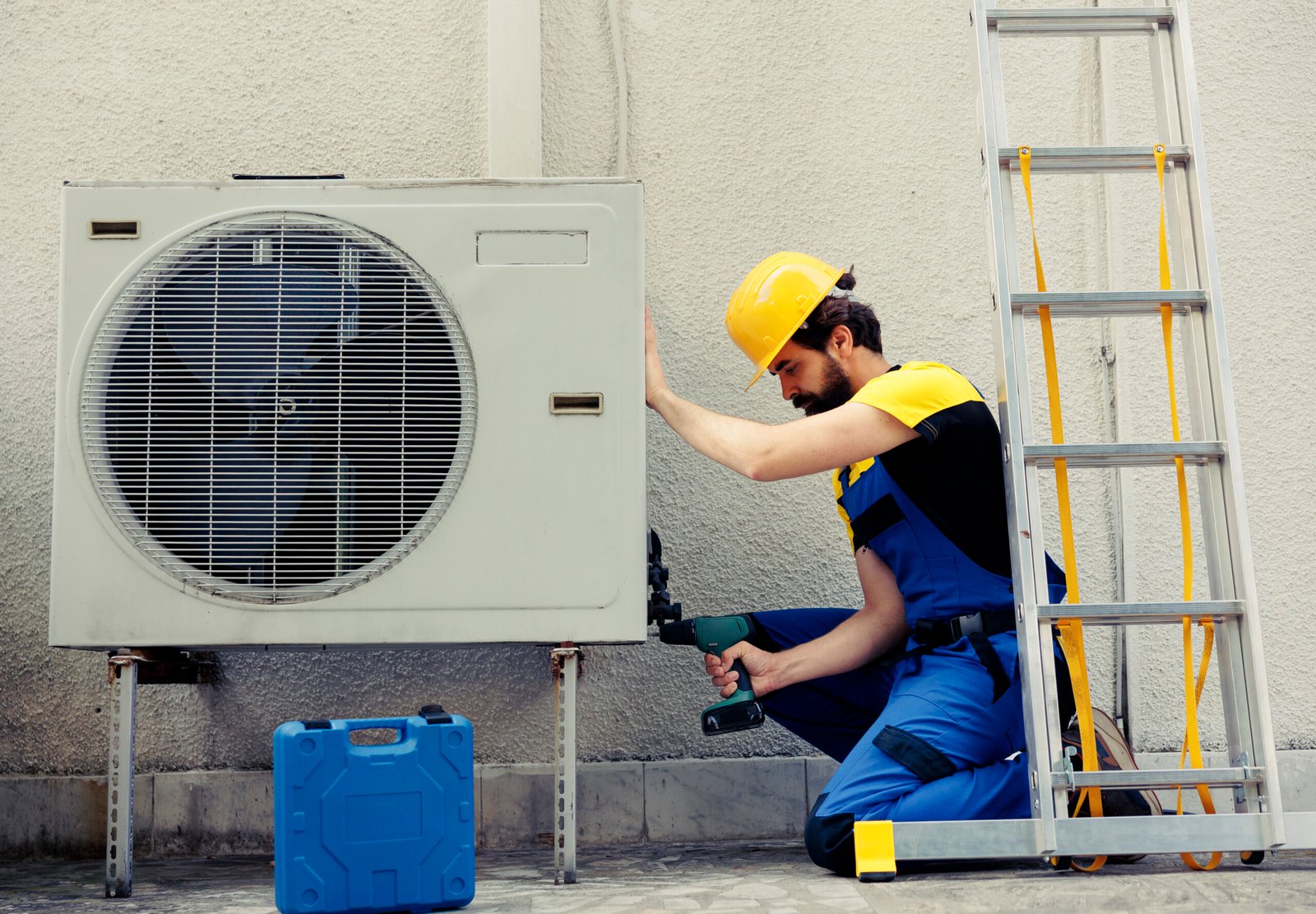 Home repairman working on air conditioner
